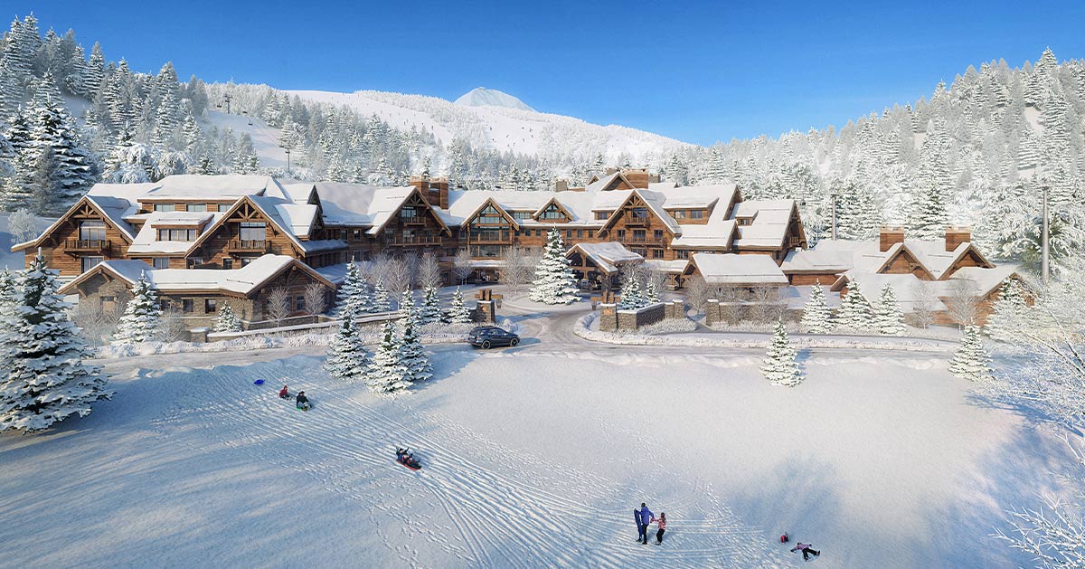 Montage Big Sky winter resort with snow-covered lodge, evergreen trees, guests sledding, and mountain peaks under blue sky